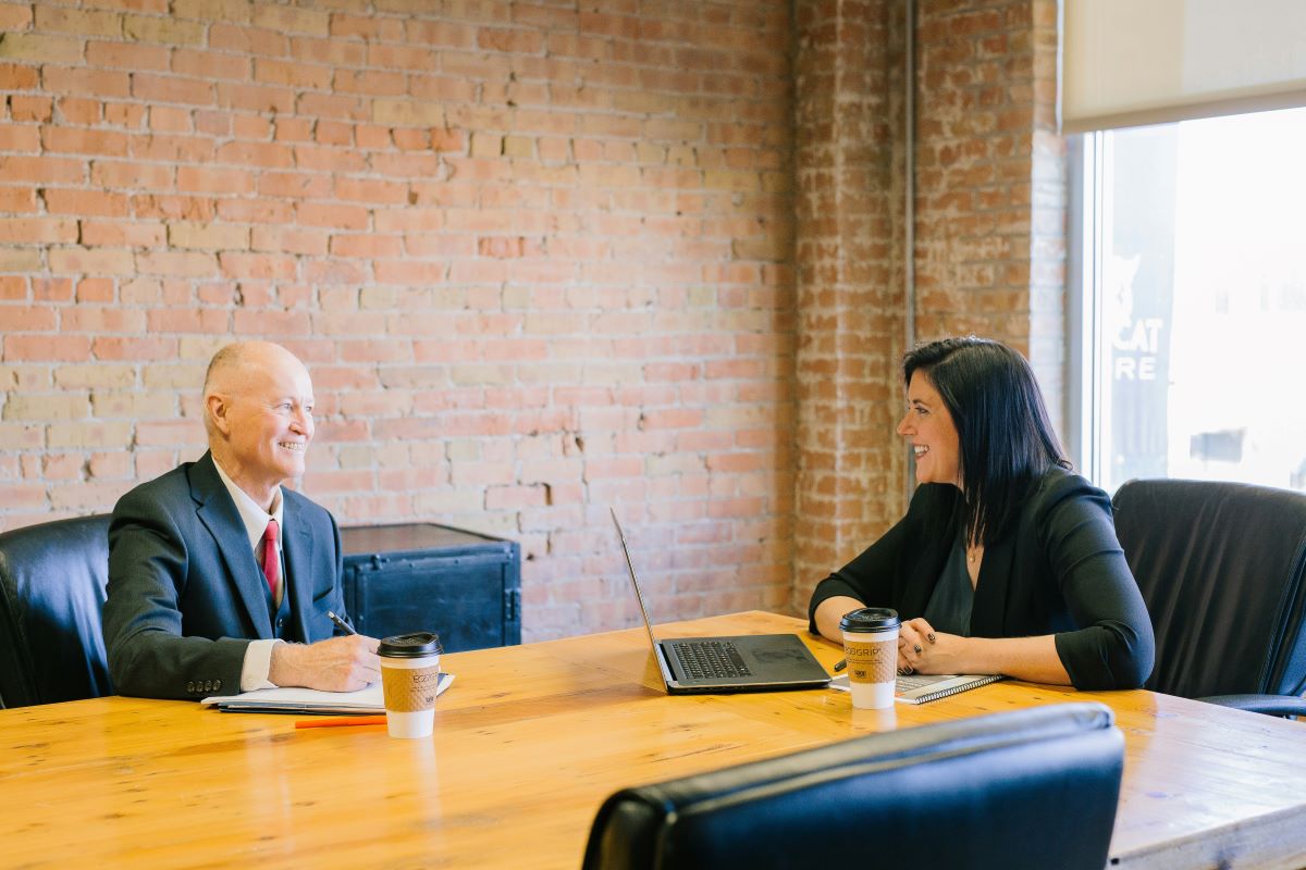 business professionals chatting at conference table