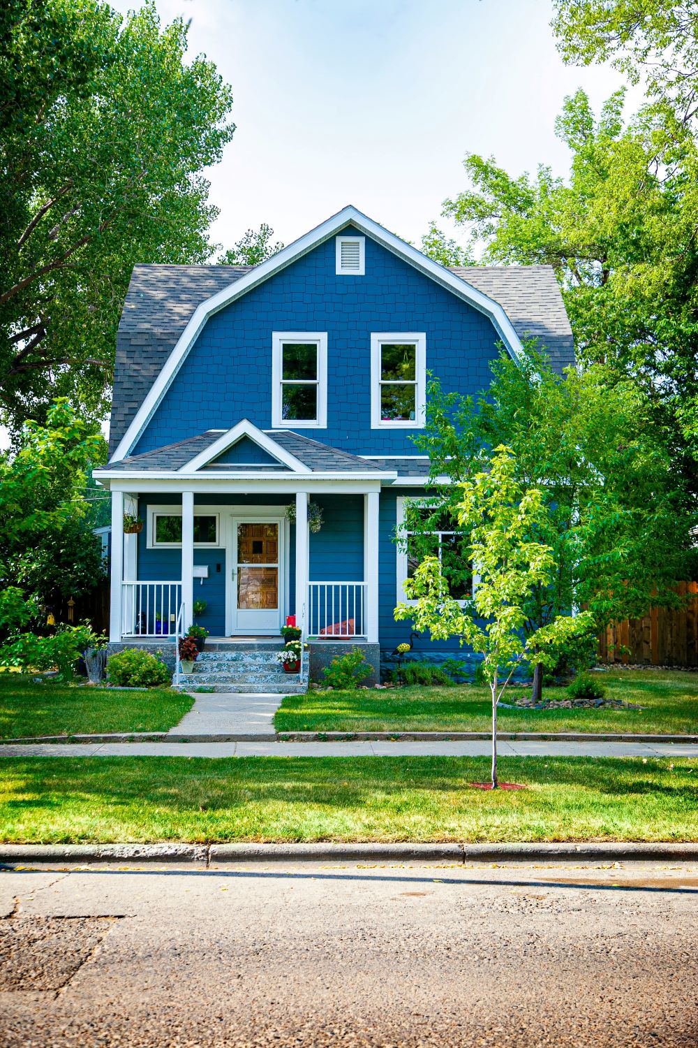 two story home with landscaping